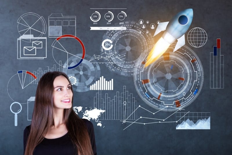 Smiling woman looking the data from different graphs, and charts